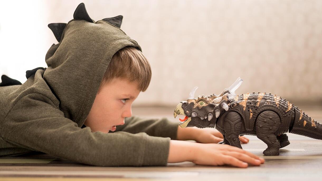 Boy with dinosaur