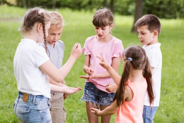 Kids playing rock, paper, scissors